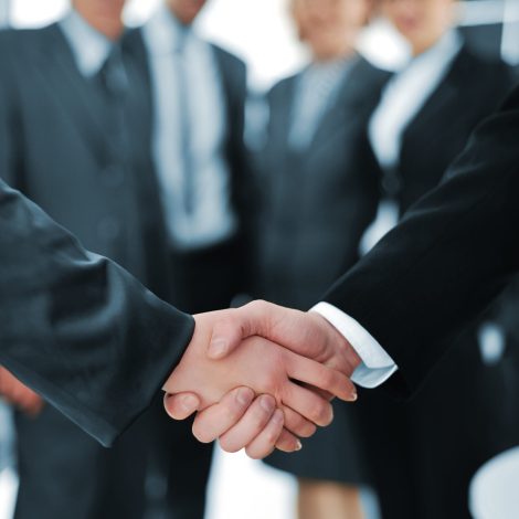 Handshake isolated on business background